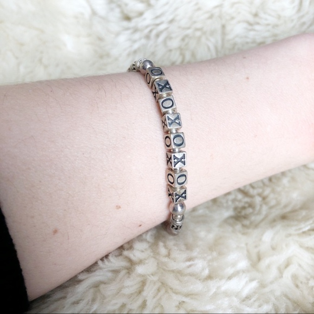 Silver tone X’s and O’s bracelet